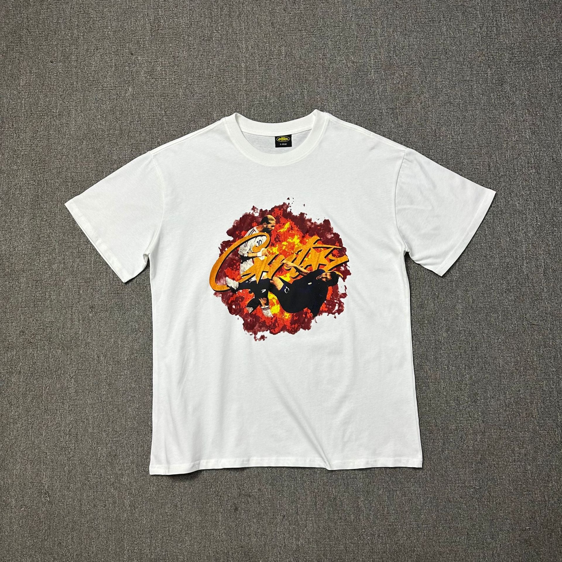White t-shirt with a graphic design on a gray background