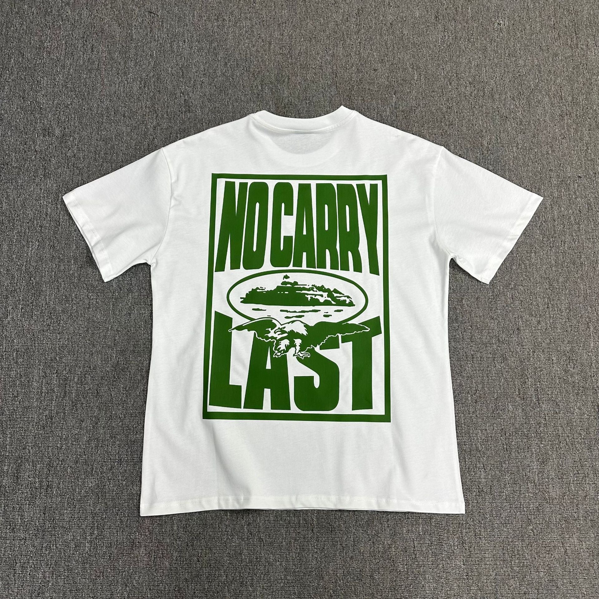 White t-shirt with green graphic and text on a gray background