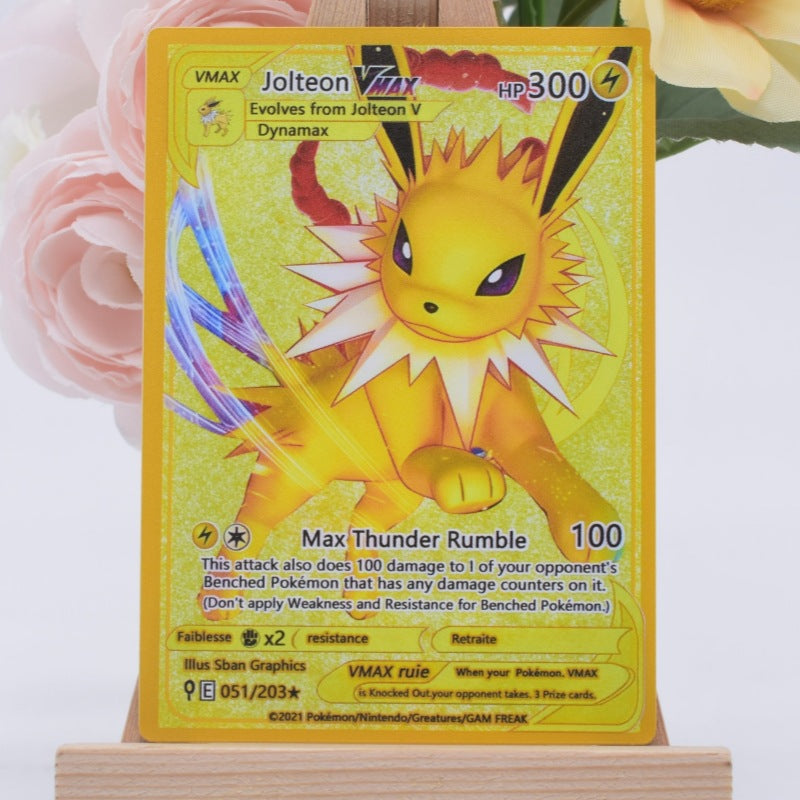 A holographic Pokémon trading card featuring Jolteon, displayed on a small wooden stand against a soft white background with blurred pink roses.