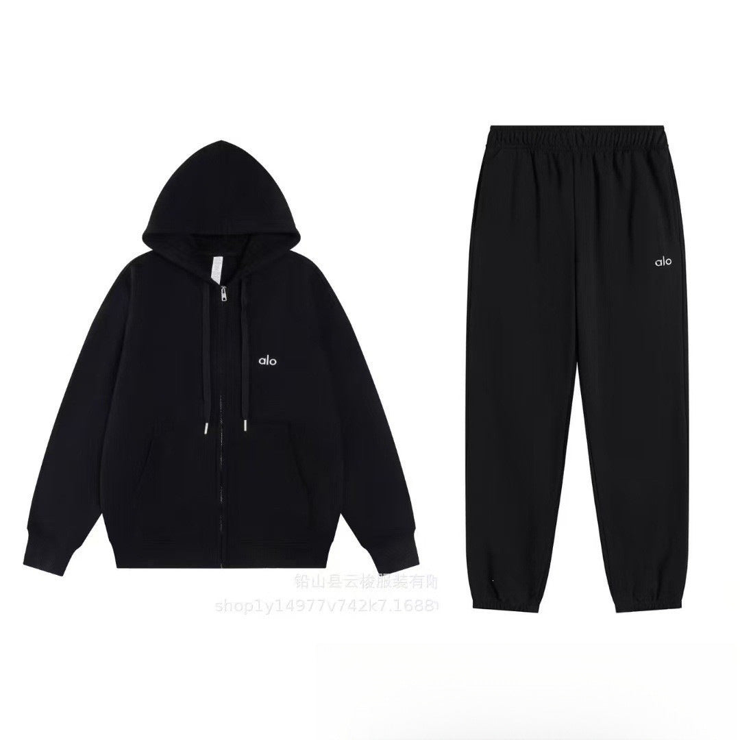 Black hoodie and pants set with a logo on a white background