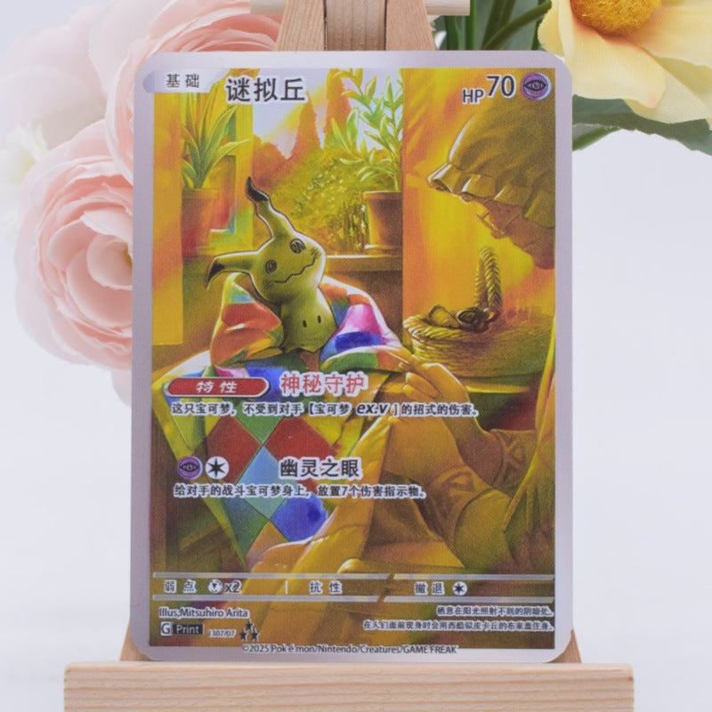 A Pokémon trading card featuring Piplin, displayed upright on a small wooden stand with pink flowers in the background.