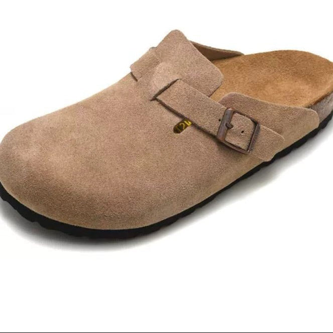 Brown suede clog shoe with a buckle on a white background