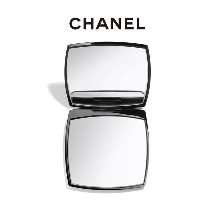 Chanel compact mirror on a white background