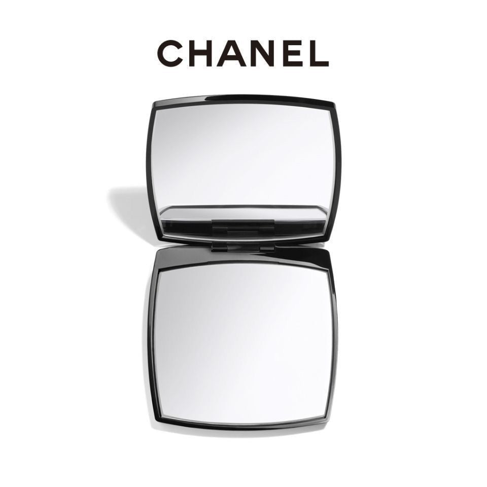 Chanel compact mirror on a white background