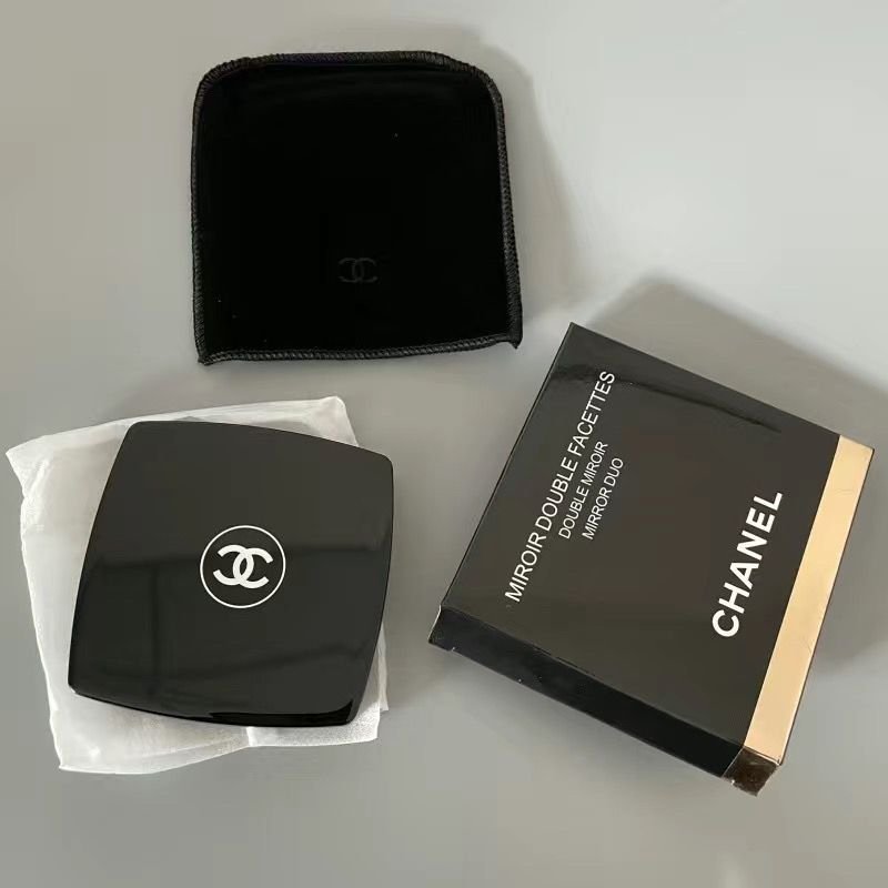 Chanel makeup mirror and case on a light gray background