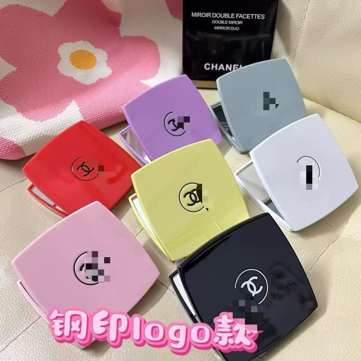 Colorful compact mirrors with brand logos on a floral background
