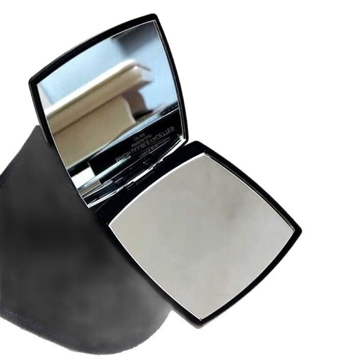 Compact powder with mirror on a white background