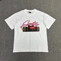 White t-shirt with graphic design on a gray background