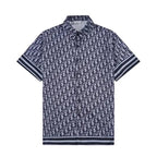 Navy blue polo shirt with white pattern on a white background