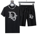 Black t-shirt and shorts set with 'DD' logo on a hanger against a white background