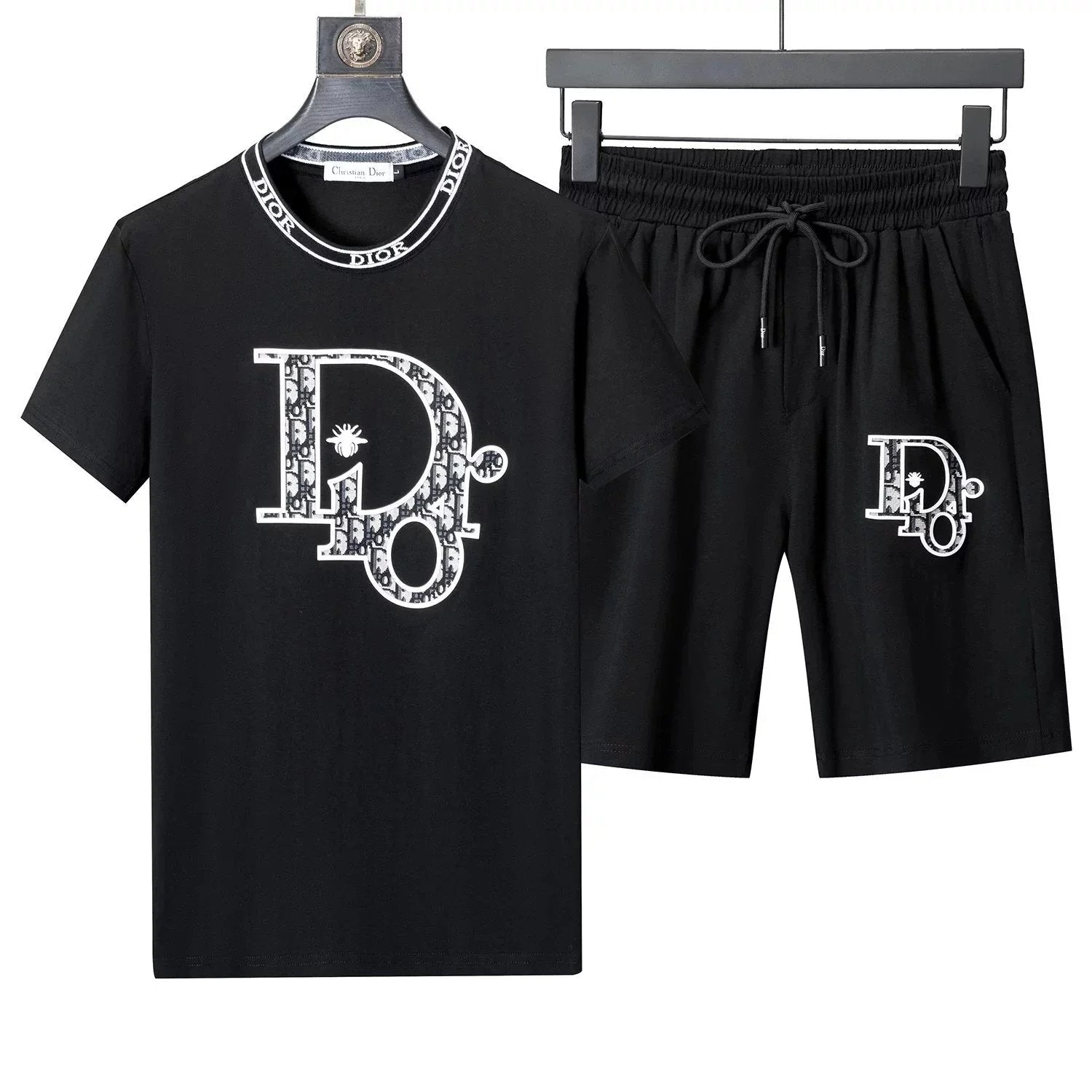 Black t-shirt and shorts set with 'DD' logo on a hanger against a white background