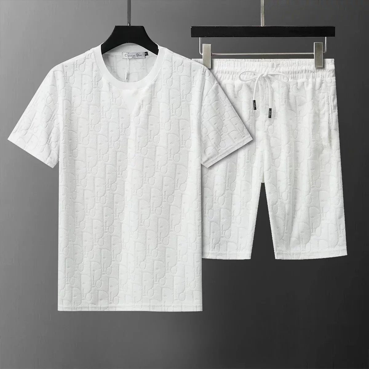 White t-shirt and shorts set on a dark background