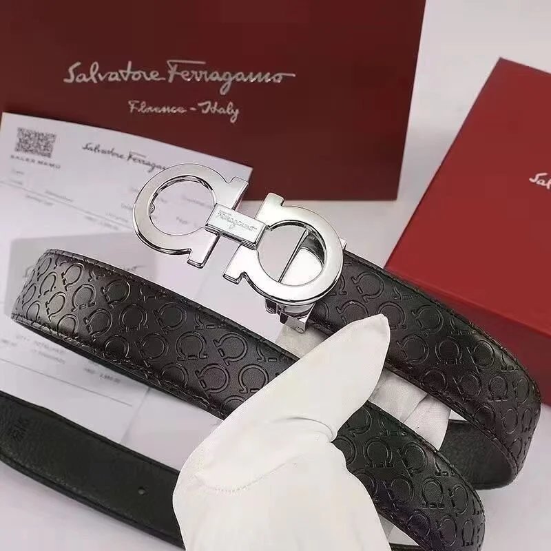 Black leather belt with silver Ferragamo buckle on a white surface