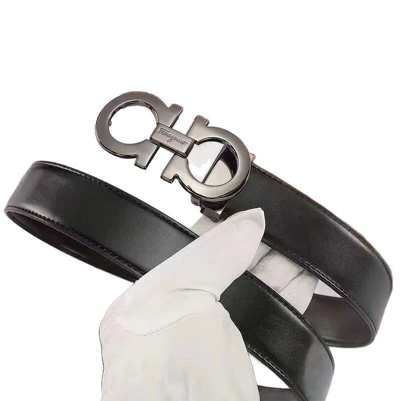 Black leather belt with silver Ferragamo buckle held by a white-gloved hand on a white background
