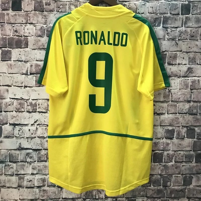 Yellow sports jersey with 'RONALDO' and number '9' on a brick wall background