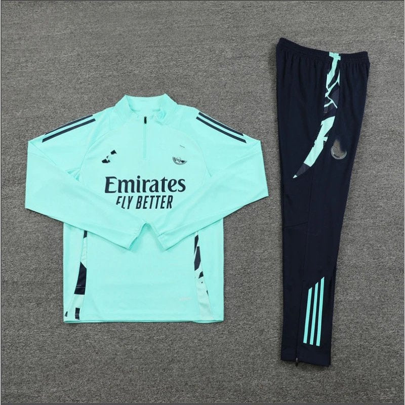 Light blue tracksuit with 'Emirates Fly Better' text and black pants on a gray background
