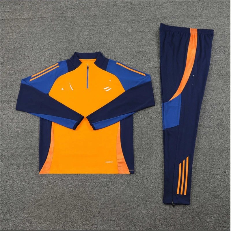 Orange and blue tracksuit on a gray background