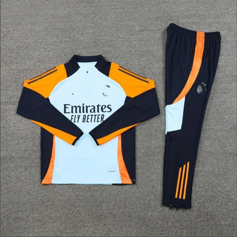 Navy and orange tracksuit with Emirates branding on a gray background