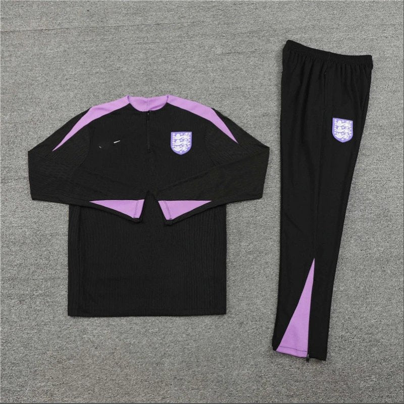 Black and purple tracksuit on a gray background