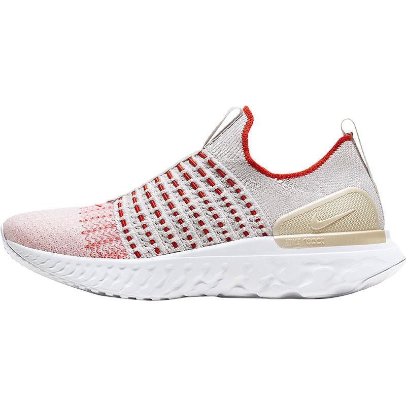 White and red sneaker with a visible brand logo on a white background