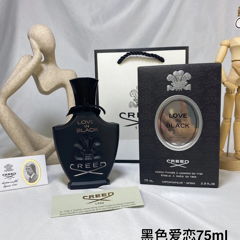 Creed Love in Black perfume bottle and packaging on a white background