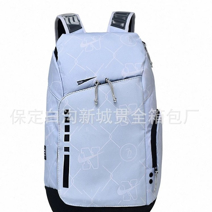 A light blue and black backpack with a subtle geometric pattern, shown against a plain white background. The backpack features padded shoulder straps, a front zippered pocket with silver zipper pulls, and a main compartment.