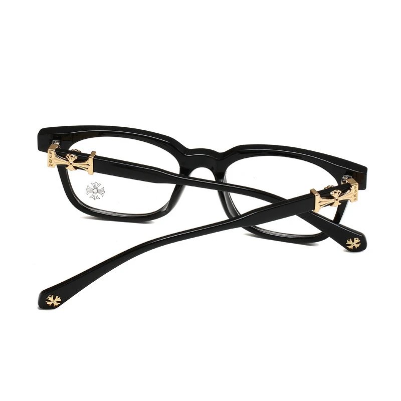 Black eyeglasses with gold accents on a white background