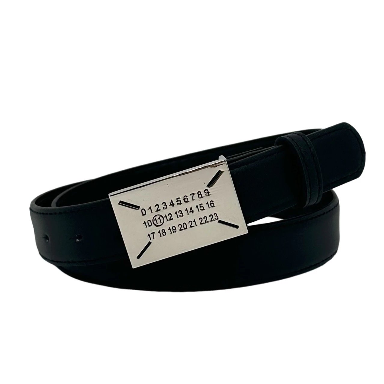 Black belt with a metallic buckle on a white background