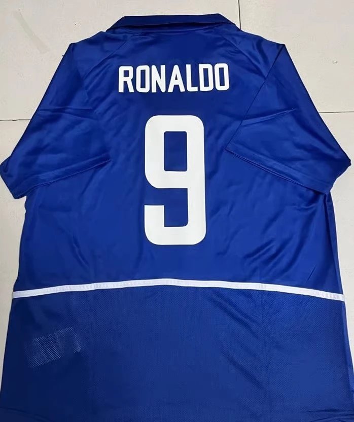 Blue sports jersey with 'RONALDO' and number '9' on a white background
