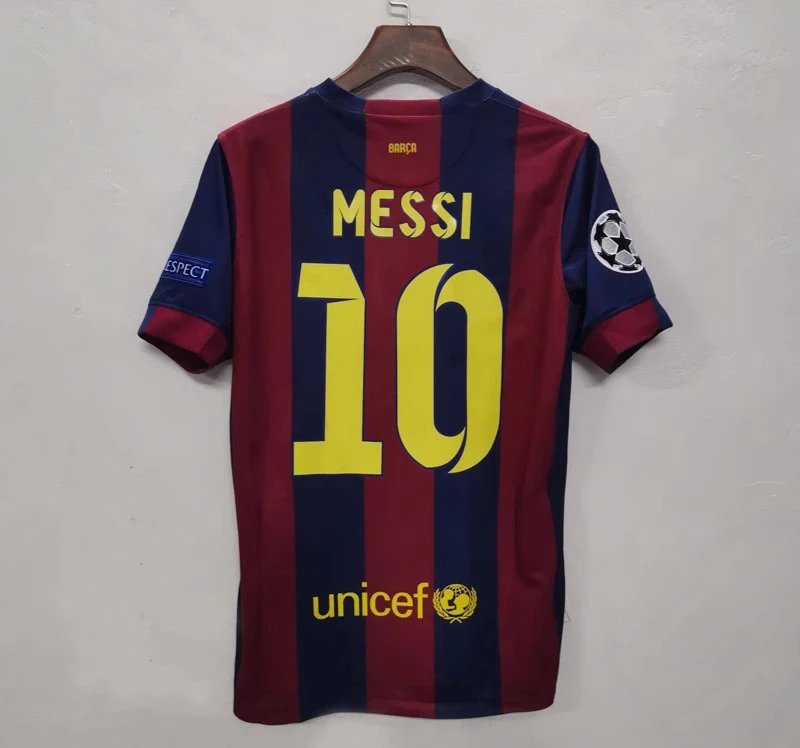 Soccer jersey with 'Messi 10' on a hanger against a plain background
