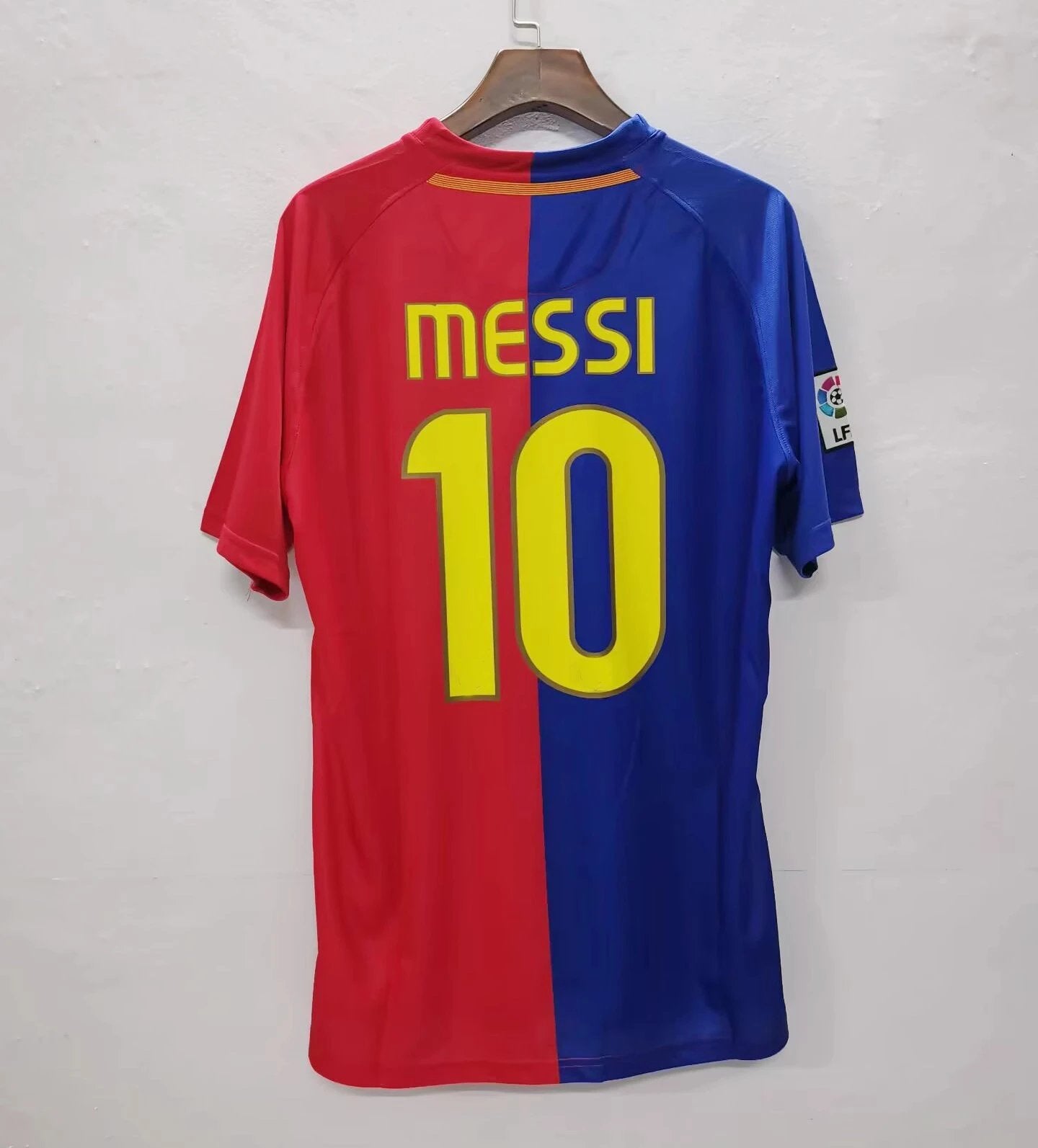 Red and blue sports jersey with 'Messi 10' on a white background