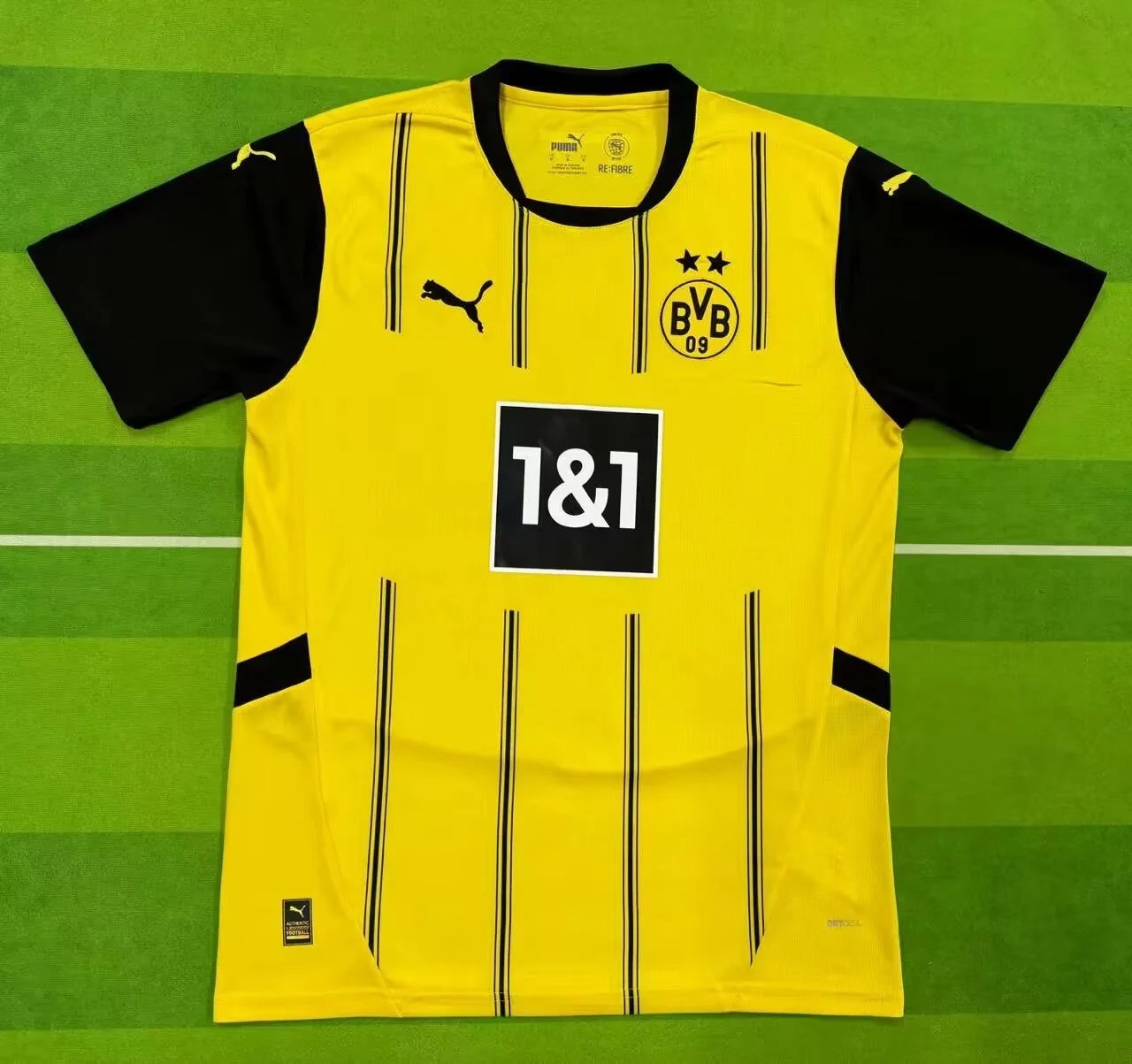 Yellow sports jersey with black accents on a green field background