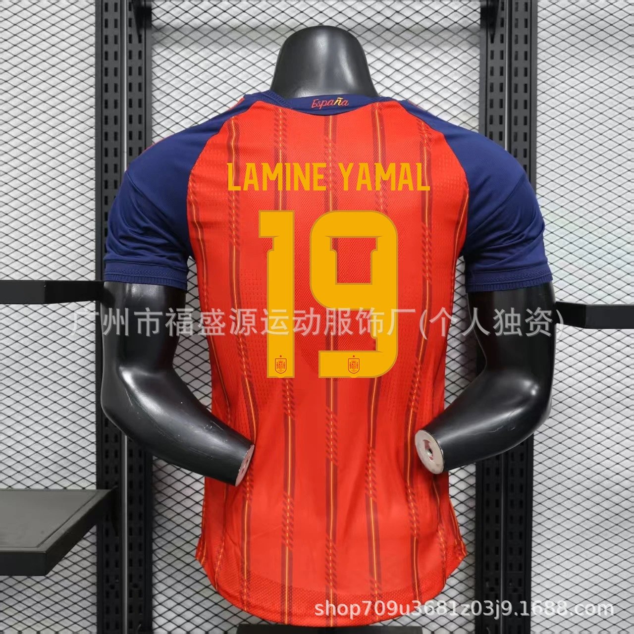 Orange sports jersey with blue sleeves on a mannequin against a metal grid background