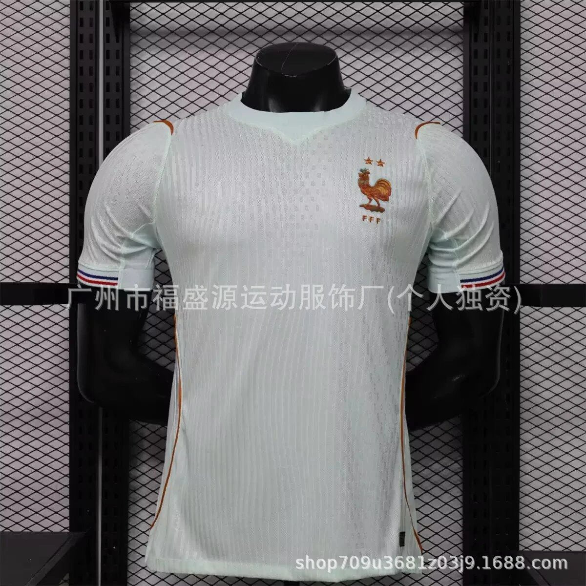 White sports jersey with a logo on a mannequin against a black grid background
