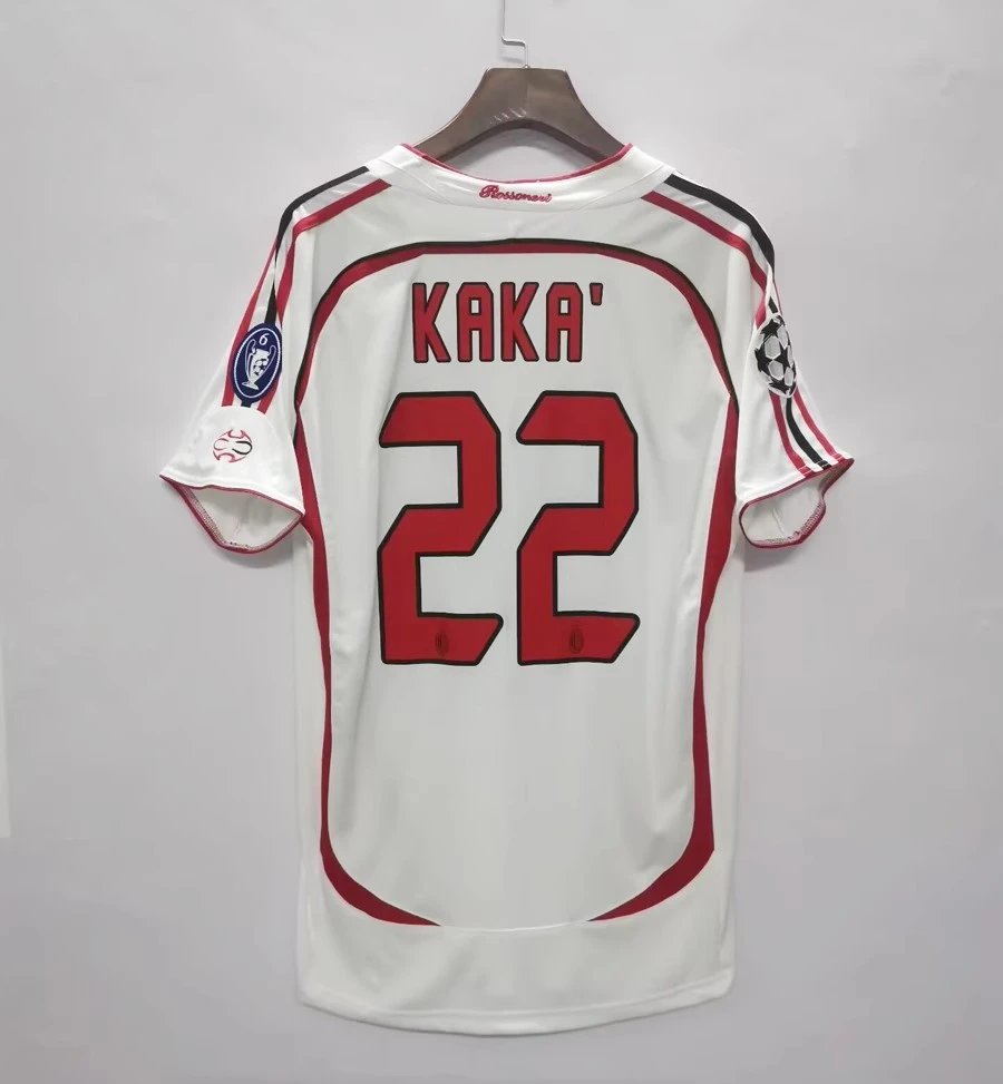 White sports jersey with red accents and 'Kaka' 22' printed on a gray background