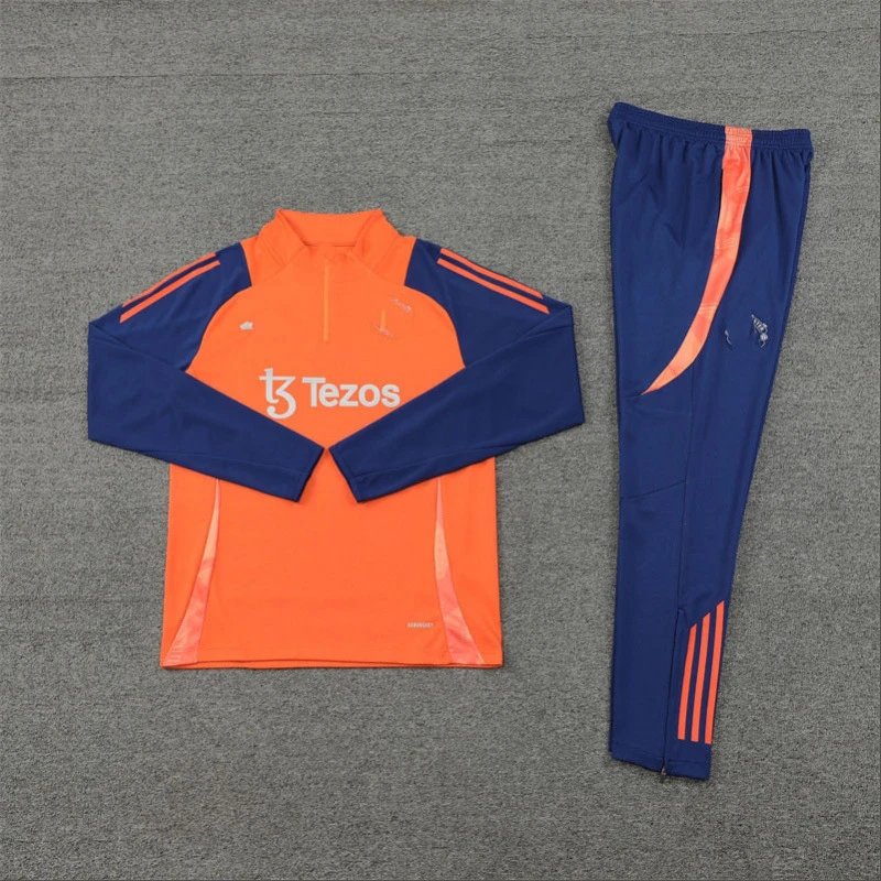 Orange and blue tracksuit with 'Tezos' branding on a gray background