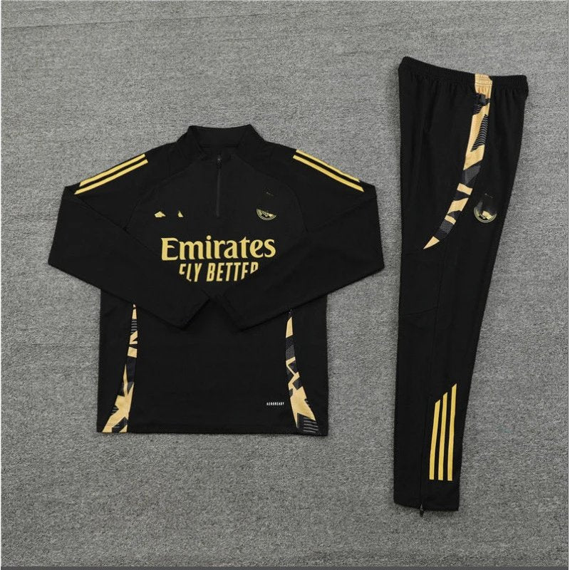 Black tracksuit with gold accents and 'Emirates Fly Better' text on a gray background