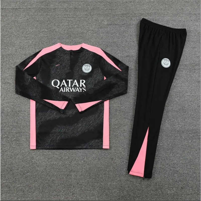 Black and pink Qatar Airways outfit with buttons on a gray background