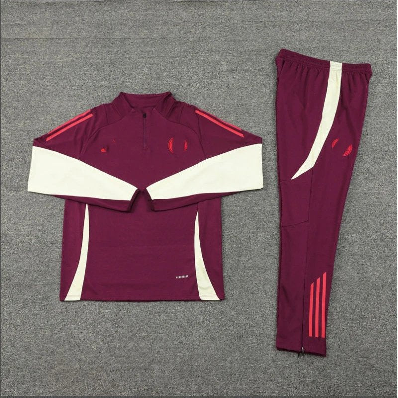 Maroon tracksuit with white and red accents on a gray background