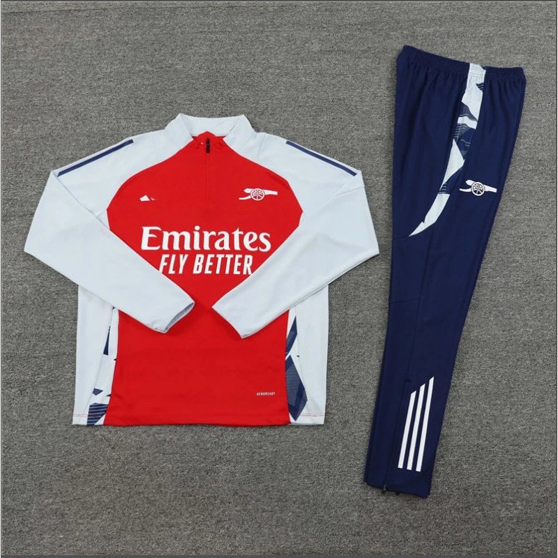 Red and white tracksuit with navy pants on a gray background