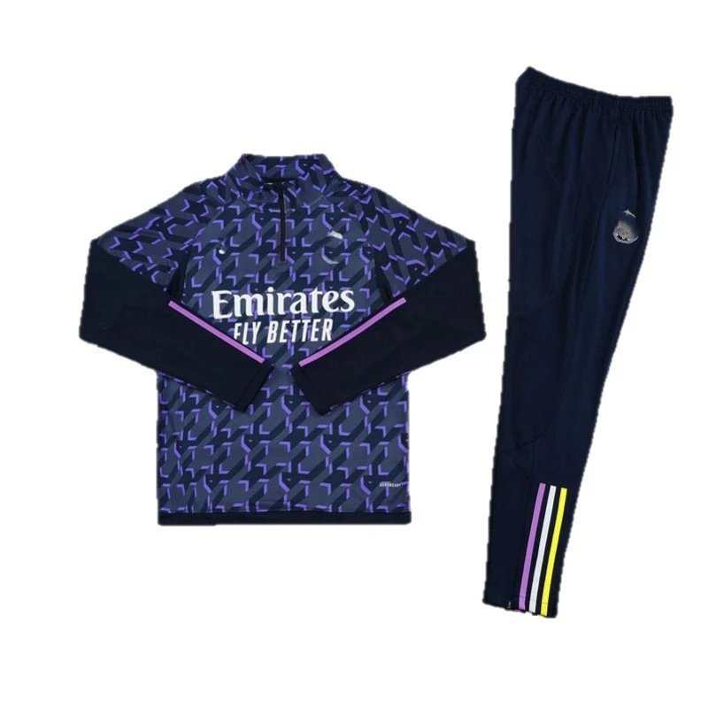 Navy tracksuit with patterned top and plain pants on a white background