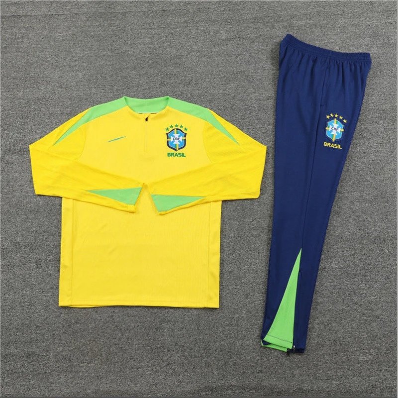 Yellow and green sports outfit with blue pants on a gray background