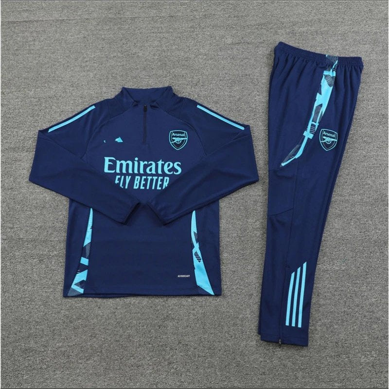 Navy tracksuit with Emirates branding on a gray background