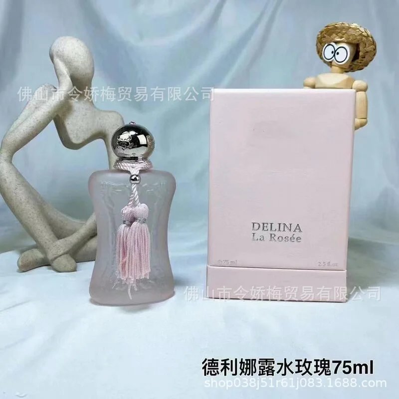 Delina La Rosee perfume bottle and packaging on a light blue background
