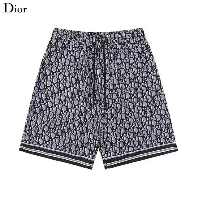 Black and gray patterned shorts with Dior logo on a white background