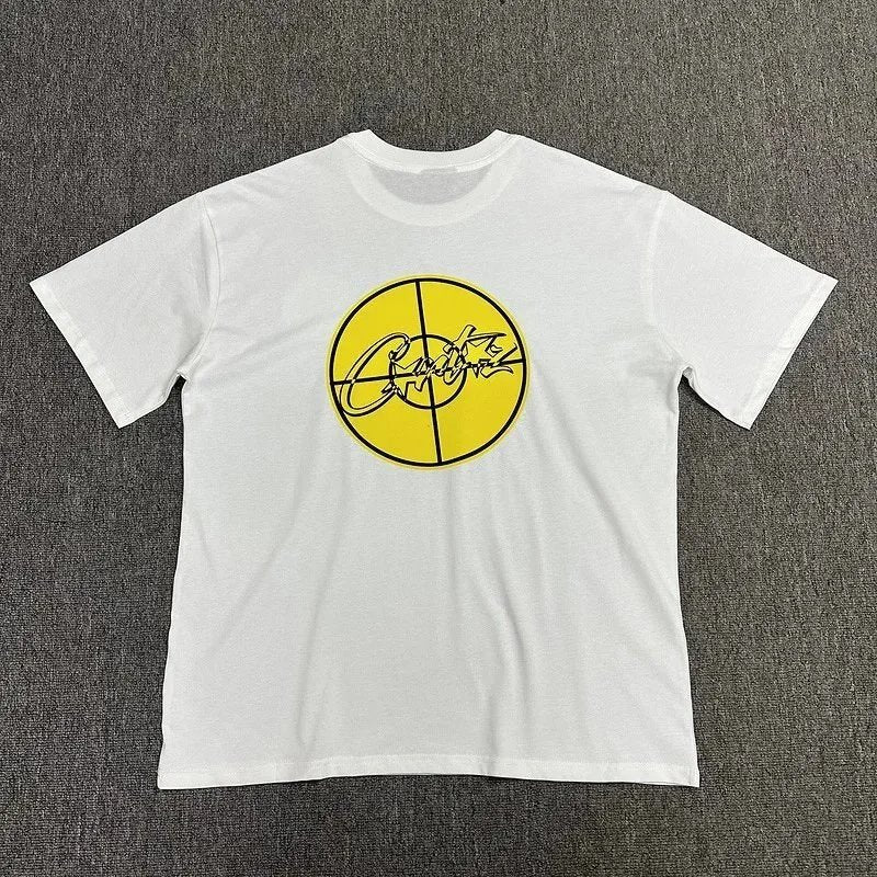 White t-shirt with yellow graphic design on a gray background