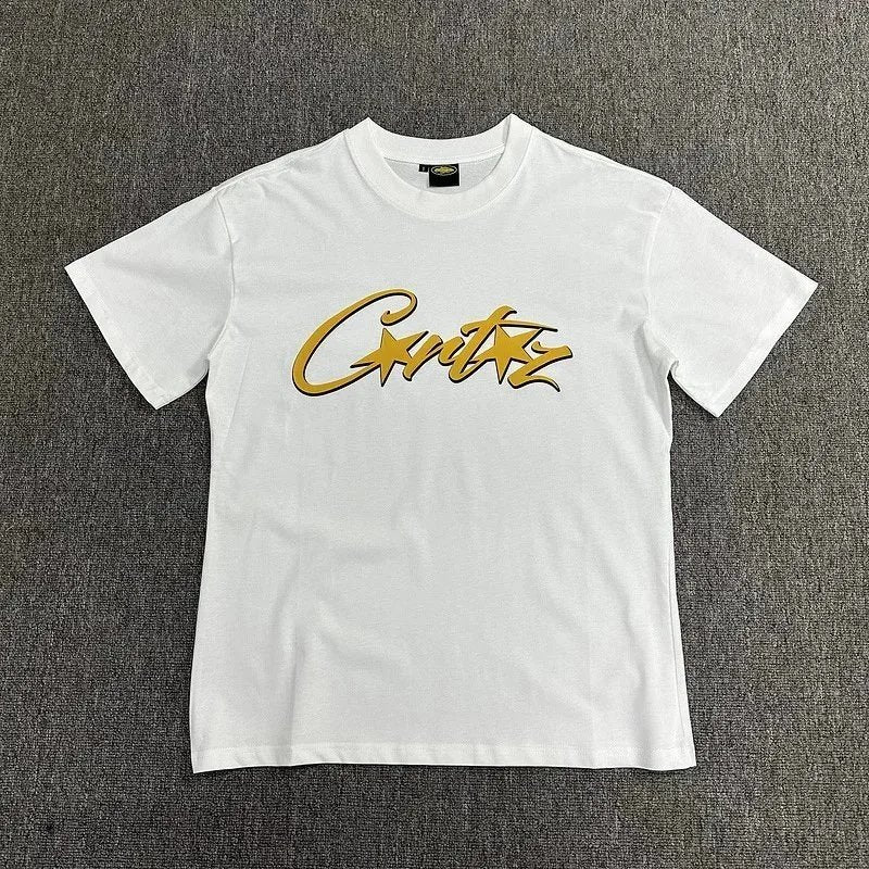 White t-shirt with gold text on a gray background