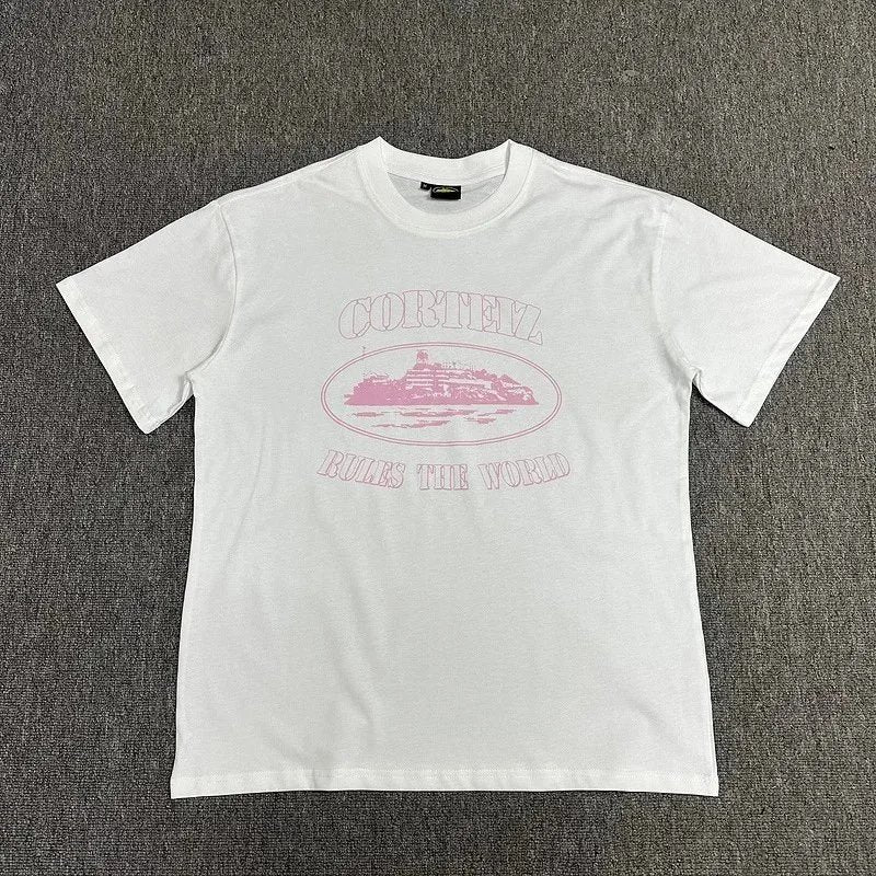 White t-shirt with pink graphic and text on a gray background