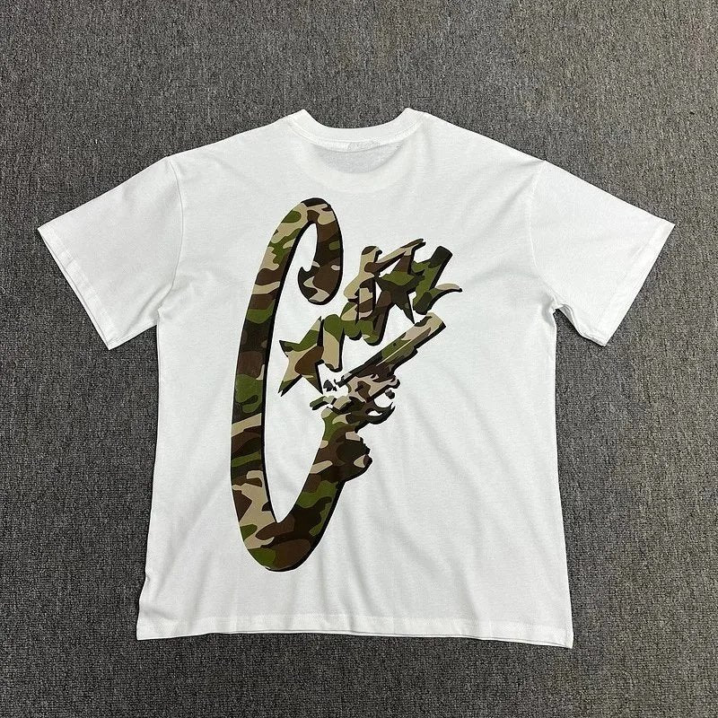 White t-shirt with a camouflage graphic on a gray background