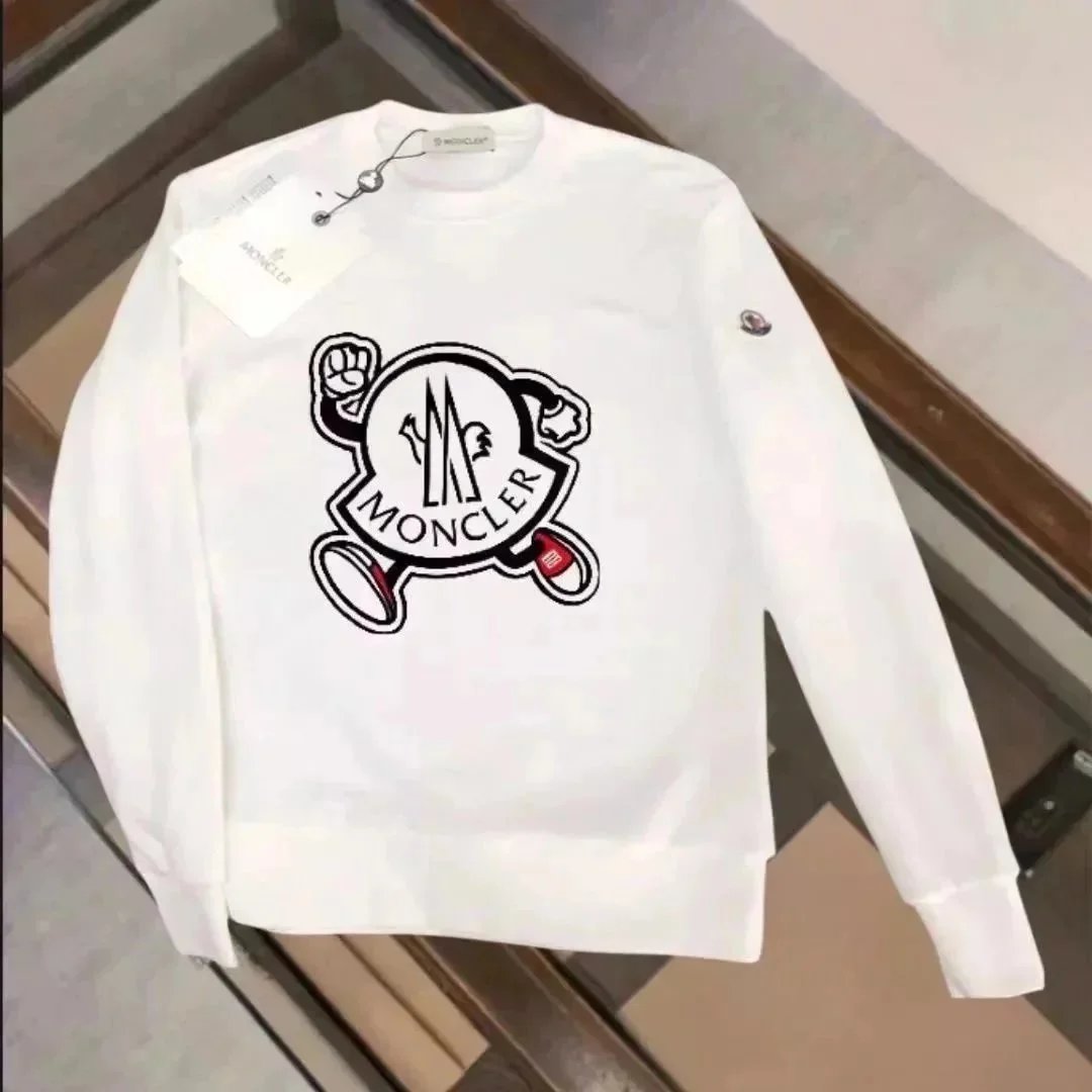 White sweatshirt with a graphic design on a wooden floor